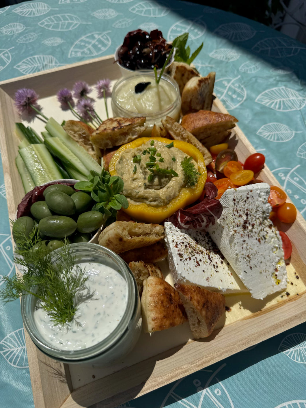 Mezze Platter ·  Tzatziki, Skordalia, Creamy Basil Hummus, Cucumbers, Marinated Olives, Tomatoes, Feta with Olive Oil & Sumac  - Pita  (serves 6-10)